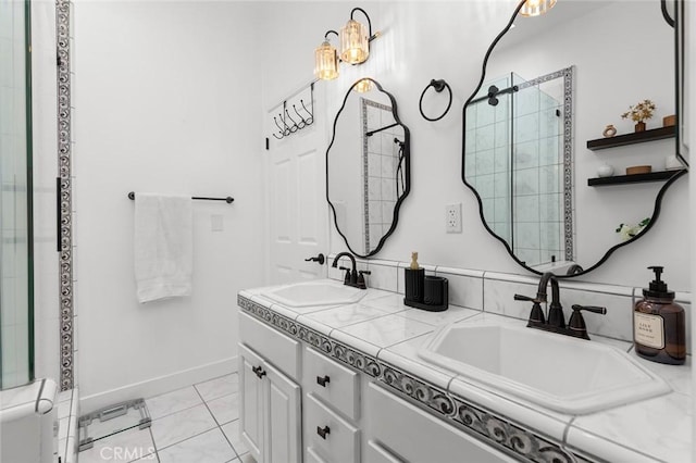 6582 Corrine Cir, Huntington Beach, CA 92647 - bathroom with baseboards, a sink, double vanity, and a tile shower
