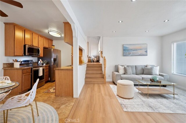 kitchen featuring stainless steel appliances, recessed lighting, and open floor plan