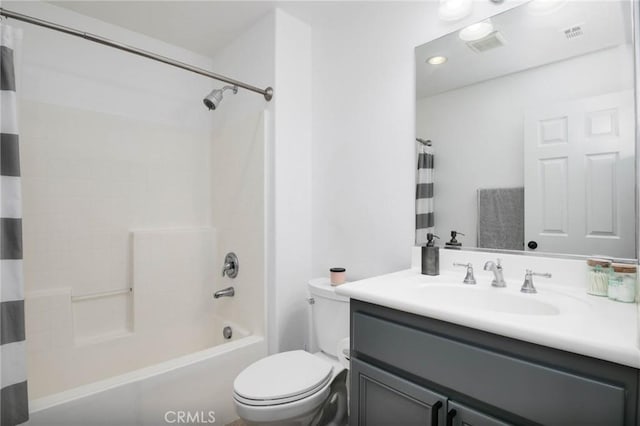 full bath with toilet, visible vents, shower / bath combo, and vanity