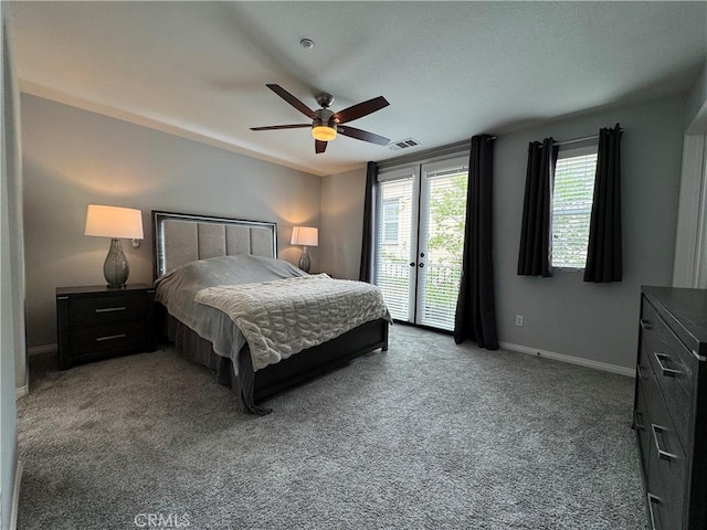 carpeted bedroom featuring visible vents, baseboards, ceiling fan, and access to exterior