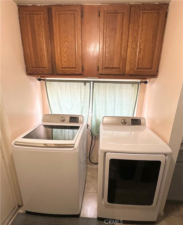 laundry room with washing machine and clothes dryer