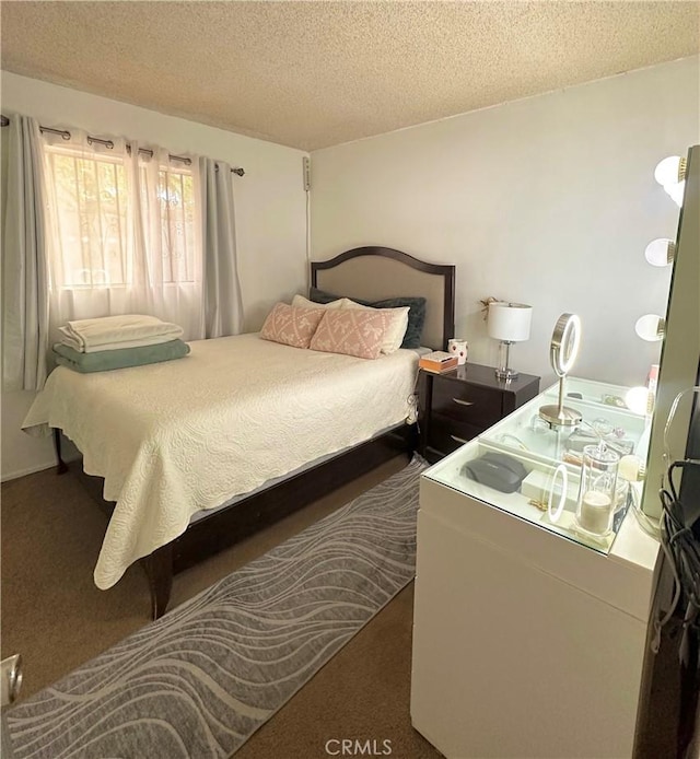 carpeted bedroom with a textured ceiling