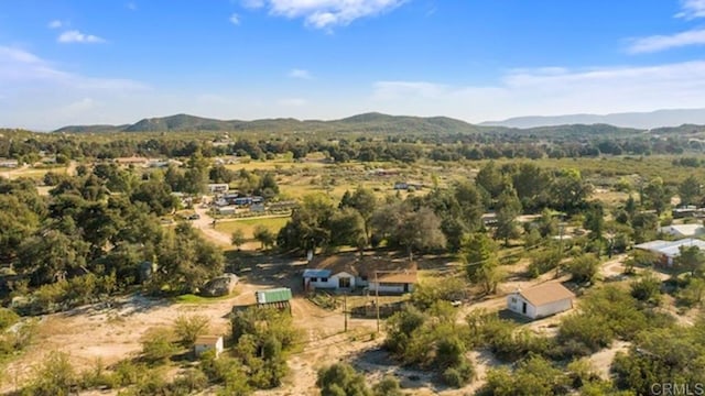 birds eye view of property featuring a mountain view