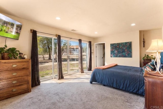 carpeted bedroom featuring access to outside, recessed lighting, and visible vents