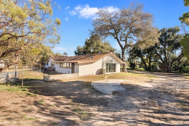rear view of property with a chimney