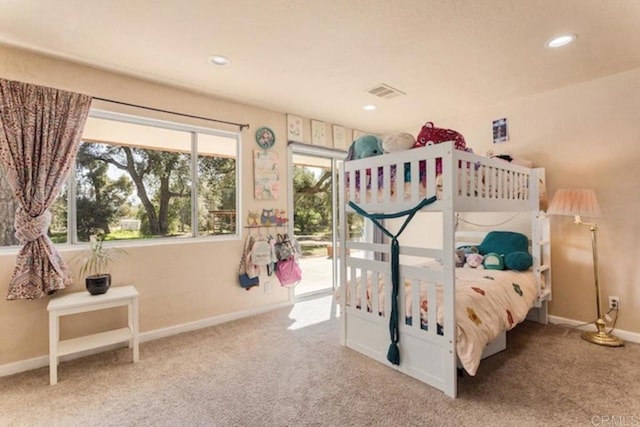 carpeted bedroom with baseboards, recessed lighting, and visible vents