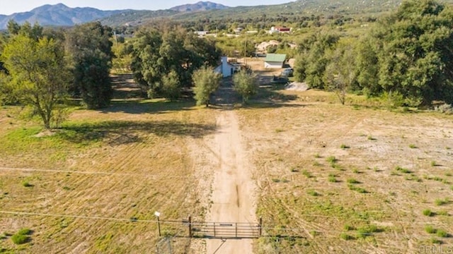 drone / aerial view with a mountain view and a rural view