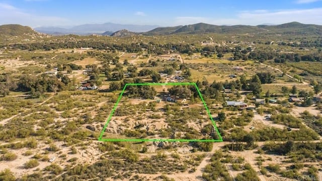 mountain view featuring a rural view