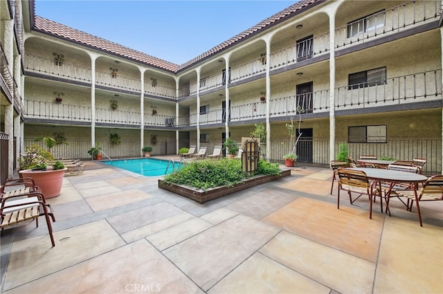 view of pool with a patio area
