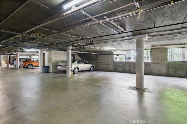 parking deck featuring concrete block wall