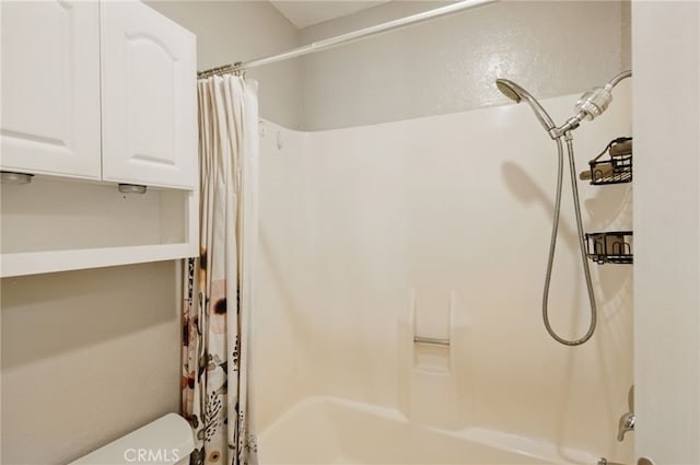 bathroom featuring shower / bath combo with shower curtain