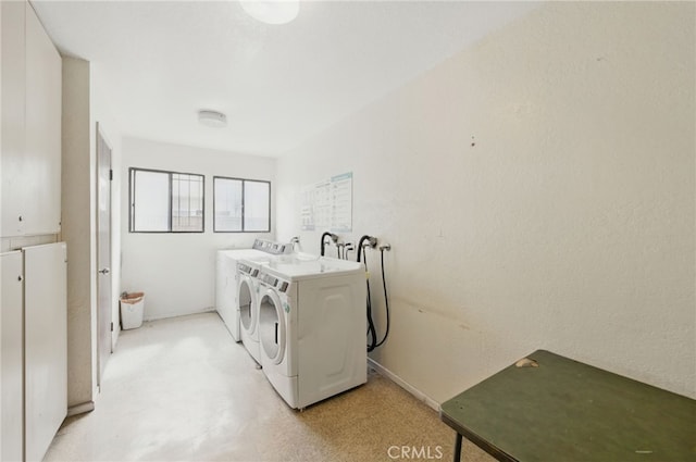 common laundry area with separate washer and dryer