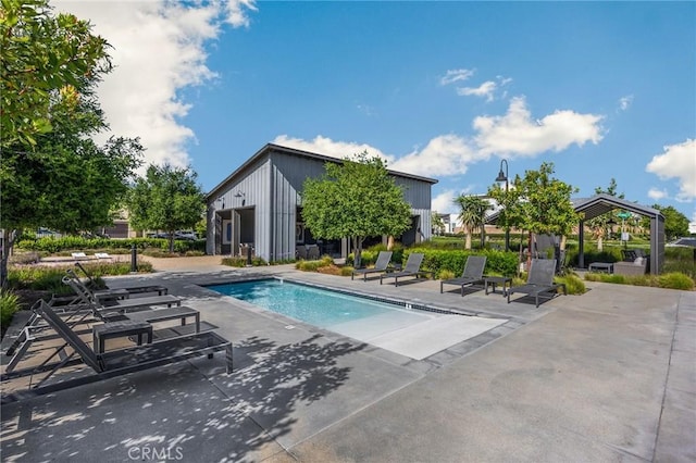 community pool featuring a patio and a gazebo