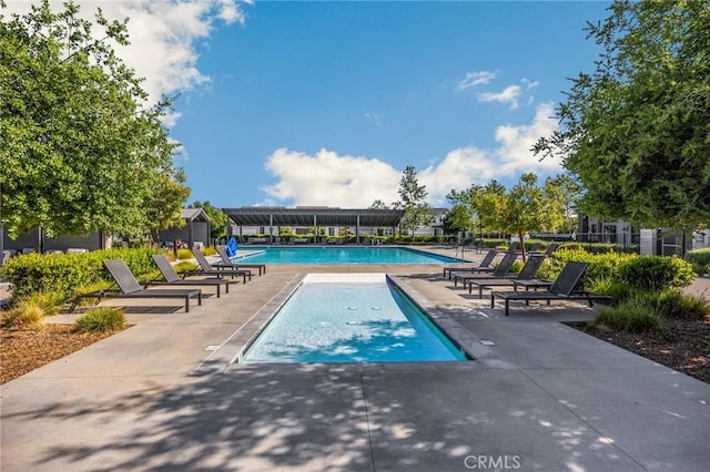 community pool with a patio