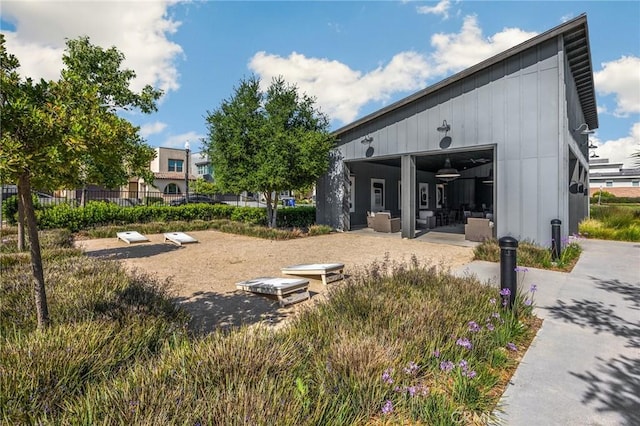 view of property's community featuring fence