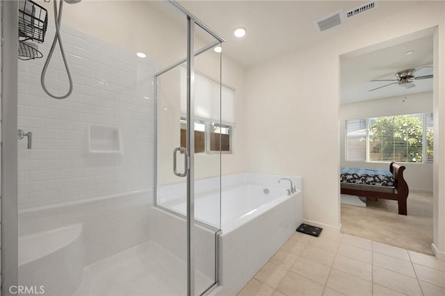 full bathroom featuring tile patterned flooring, baseboards, a shower stall, a ceiling fan, and ensuite bath
