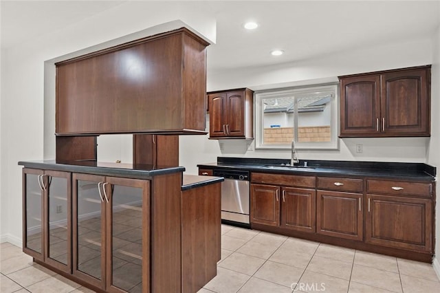 572 E Ghent St, San Dimas, CA 91773 - kitchen featuring a sink, light tile patterned floors, stainless steel dishwasher, and dark countertops