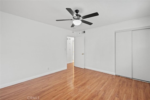 572 E Ghent St, San Dimas, CA 91773 - unfurnished bedroom featuring ceiling fan, baseboards, wood finished floors, visible vents, and a closet