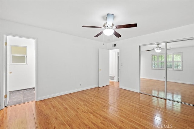 572 E Ghent St, San Dimas, CA 91773 - unfurnished bedroom featuring ceiling fan, light wood-style floors, baseboards, visible vents, and a closet