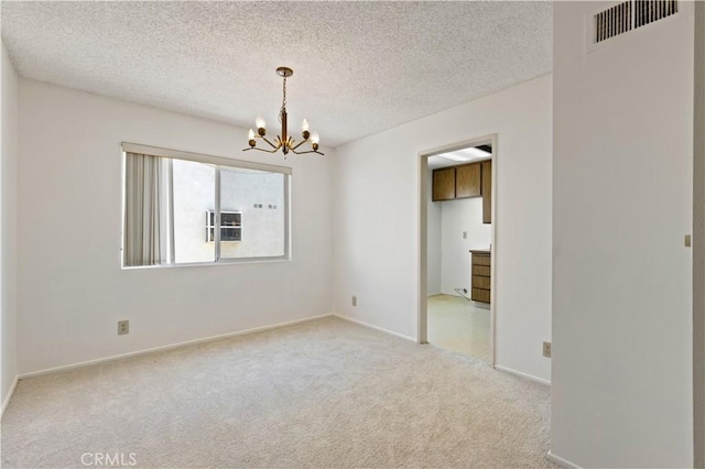 9502 Via Salerno, Burbank, CA 91504 - unfurnished room with a chandelier, light carpet, baseboards, and a textured ceiling