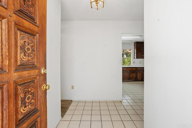 entryway featuring light tile patterned floors