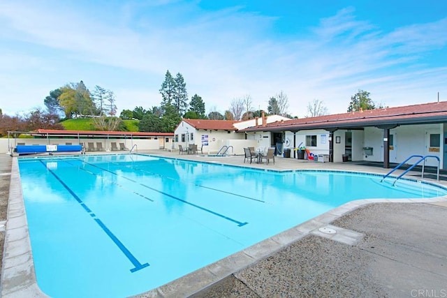 pool featuring a patio area