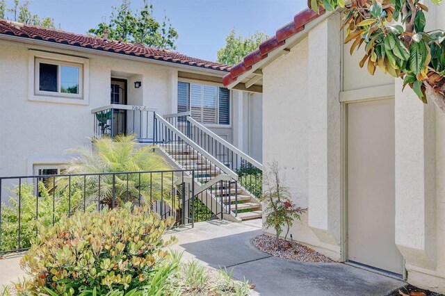 1982 Fairlee Dr, Encinitas, CA 92024 - entrance to property with stucco siding and a tile roof