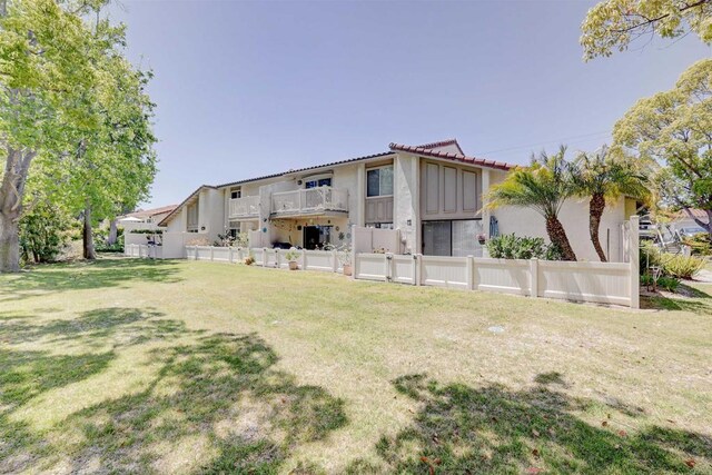 1982 Fairlee Dr, Encinitas, CA 92024 - rear view of property featuring stucco siding and a tile roof