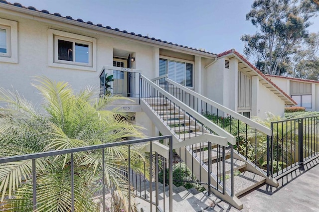 1982 Fairlee Dr, Encinitas, CA 92024 - view of front facade featuring stucco siding and stairs