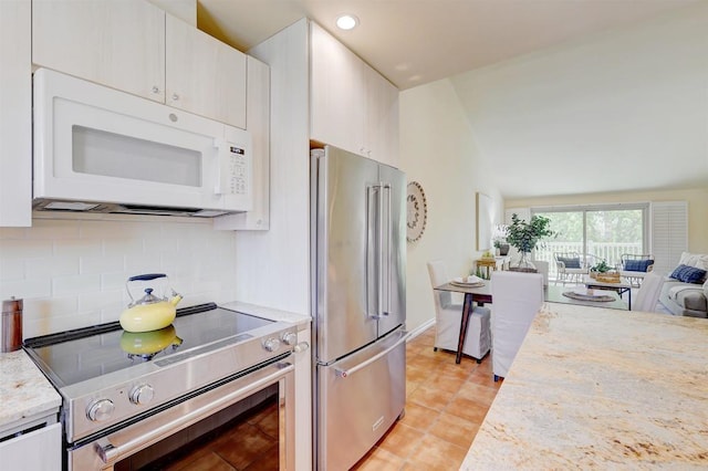 1982 Fairlee Dr, Encinitas, CA 92024 - kitchen with stainless steel appliances, open floor plan, tasteful backsplash, light tile patterned floors, and white cabinets