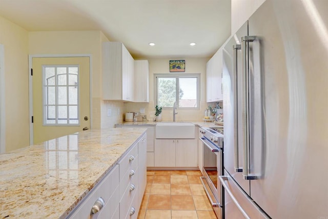 1982 Fairlee Dr, Encinitas, CA 92024 - kitchen featuring appliances with stainless steel finishes, a sink, backsplash, light stone countertops, and recessed lighting