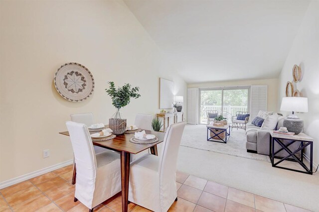 1982 Fairlee Dr, Encinitas, CA 92024 - dining area featuring vaulted ceiling, light tile patterned flooring, and light colored carpet