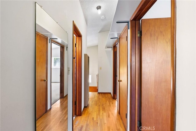 hallway featuring light wood-type flooring