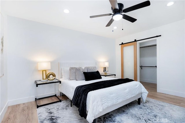 1061 Colby Cir, Thousand Oaks, CA 91362 - bedroom featuring baseboards, a barn door, wood finished floors, and recessed lighting