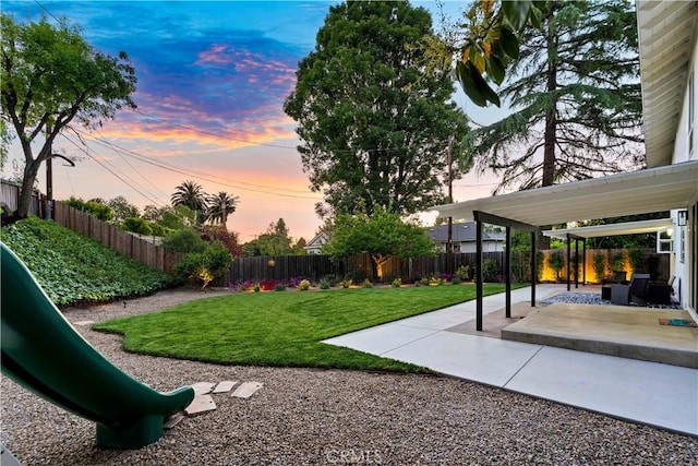 1061 Colby Cir, Thousand Oaks, CA 91362 - yard at dusk featuring a patio and a playground