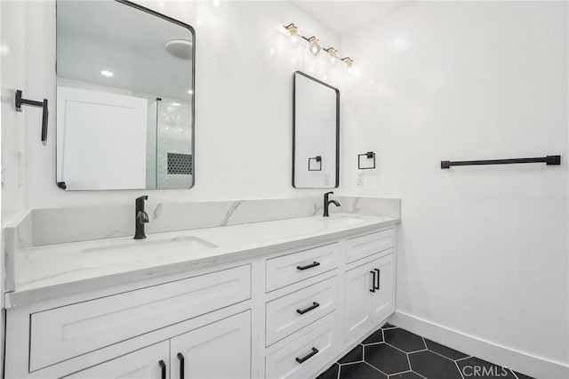 3427 S Victoria Ave, Los Angeles, CA 90016 - full bathroom with a sink, baseboards, tile patterned flooring, and double vanity