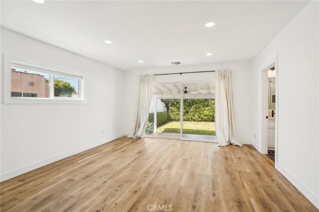 3427 S Victoria Ave, Los Angeles, CA 90016 - unfurnished room with baseboards, recessed lighting, light wood-style flooring, and visible vents