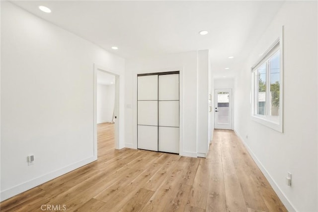 3427 S Victoria Ave, Los Angeles, CA 90016 - unfurnished bedroom with baseboards, recessed lighting, and light wood-style flooring
