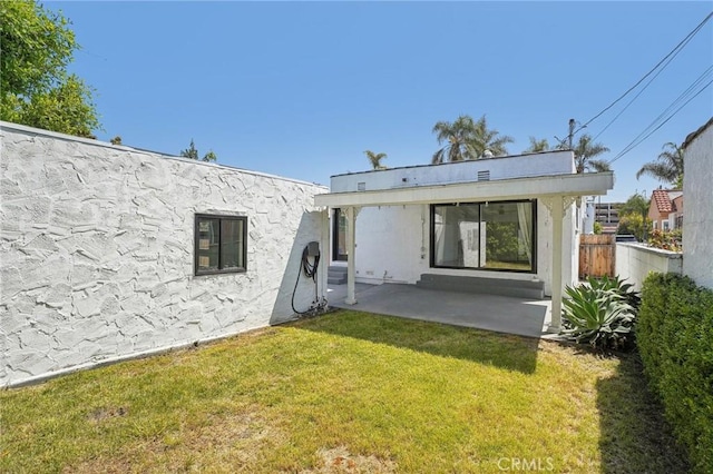 3427 S Victoria Ave, Los Angeles, CA 90016 - back of house featuring a patio, fence, and a yard