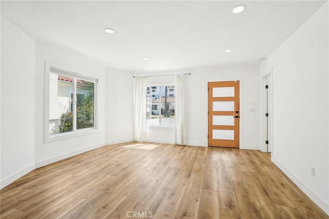 3427 S Victoria Ave, Los Angeles, CA 90016 - unfurnished room featuring recessed lighting, baseboards, and light wood-type flooring