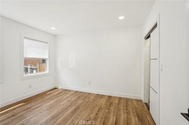 3427 S Victoria Ave, Los Angeles, CA 90016 - unfurnished bedroom featuring recessed lighting, baseboards, and light wood finished floors