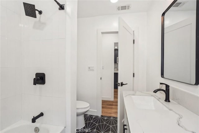 3427 S Victoria Ave, Los Angeles, CA 90016 - bathroom with bathtub / shower combination, vanity, toilet, tile patterned floors, and visible vents