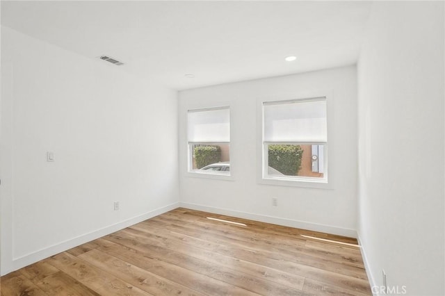 3427 S Victoria Ave, Los Angeles, CA 90016 - empty room with visible vents, recessed lighting, light wood finished floors, and baseboards