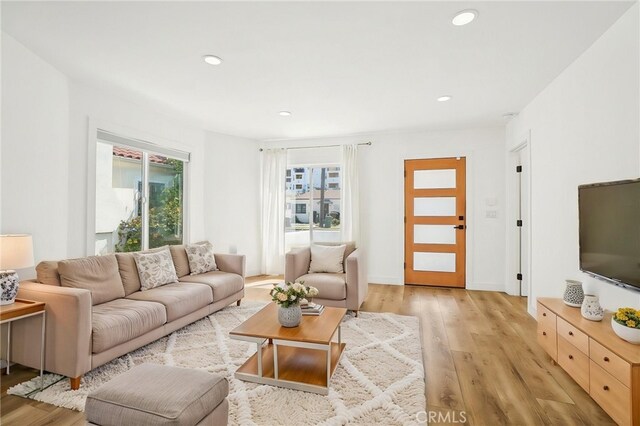 3427 S Victoria Ave, Los Angeles, CA 90016 - living room with light wood-style floors and recessed lighting