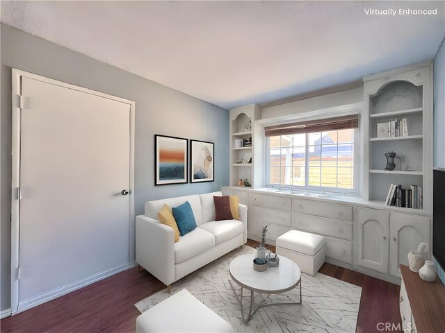 living room with built in shelves and wood finished floors