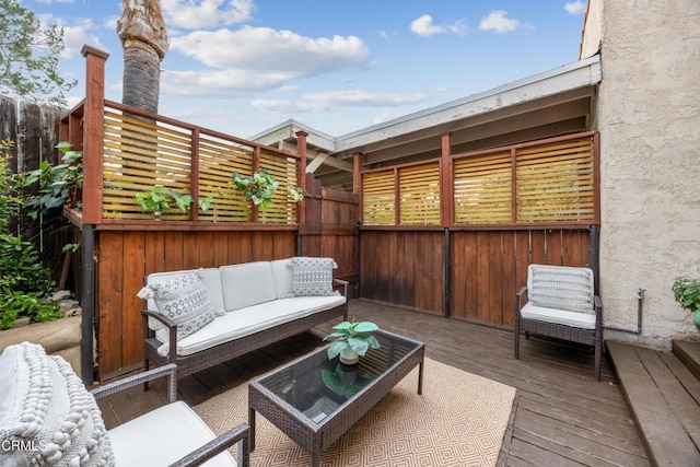wooden deck featuring fence and outdoor lounge area