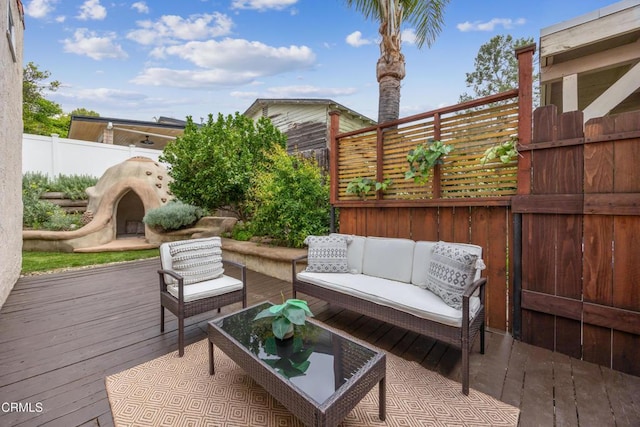 view of patio with an outdoor hangout area, a fenced backyard, and a deck