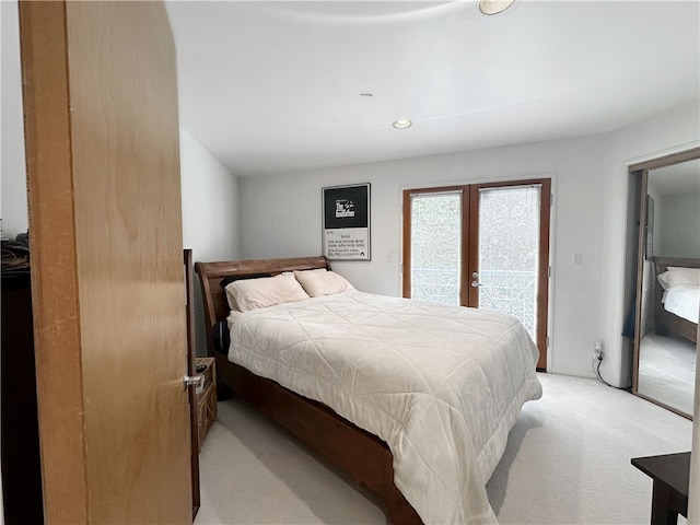 bedroom featuring recessed lighting, light carpet, french doors, and access to exterior