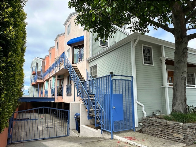 view of building exterior featuring stairs