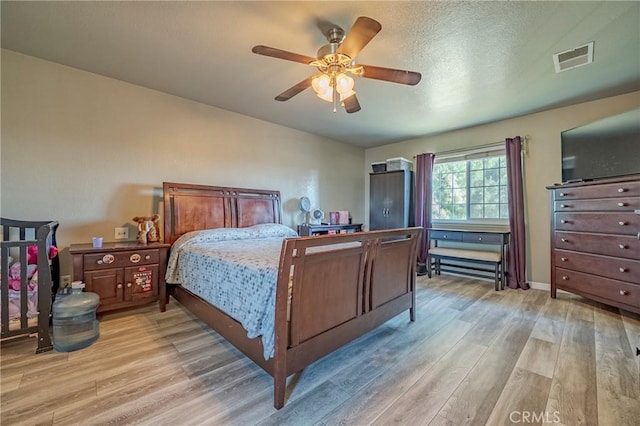 2415 E Childs Ave, Merced, CA 95341 - bedroom with a ceiling fan, visible vents, and light wood finished floors